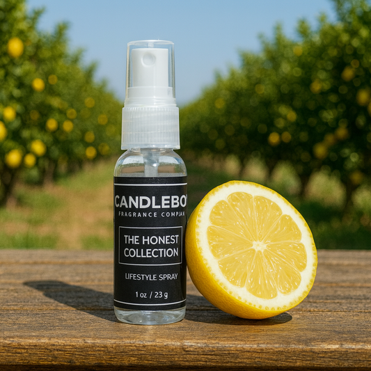 Honest Lifestyle Spray bottle from Candlebox with half lemon on wooden surface outdoors