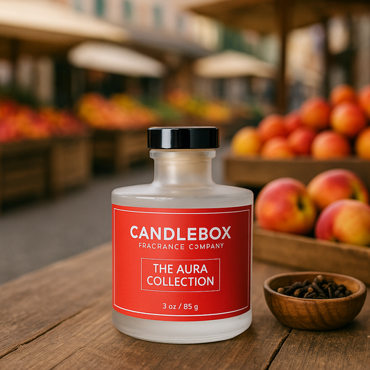 AURA Diffuser candle from Candlebox fragrance company with red label on wooden table outdoors