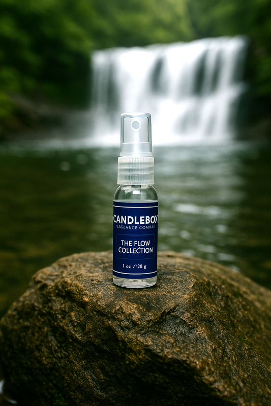 Flow Lifestyle Spray bottle from Candlebox placed on rock with waterfall background