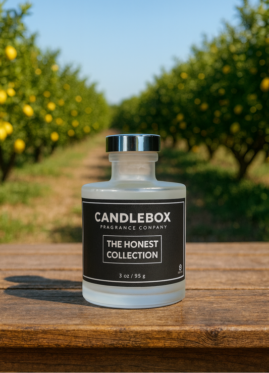 HONEST Diffuser from Candlebox on wooden table with orchard background