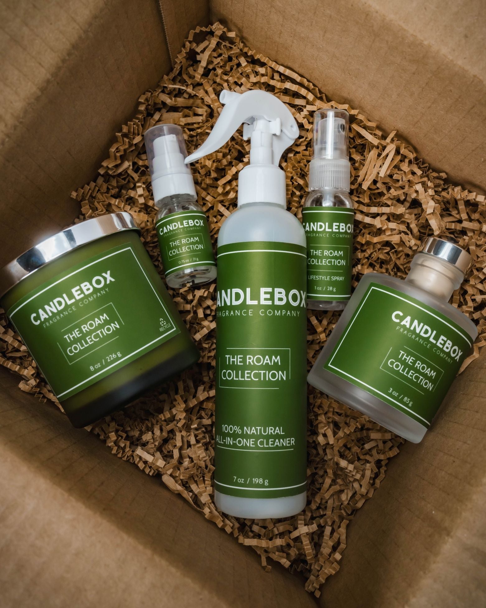 Monthly Candlebox subscription box featuring The Roam Collection natural candle and cleaning products