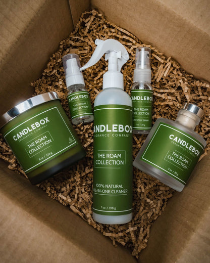 Monthly Candlebox subscription box featuring The Roam Collection natural candle and cleaning products